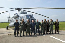 AIR FORCE PILOTS AND MECHANICS on the landing pad with the Mi-171Sh