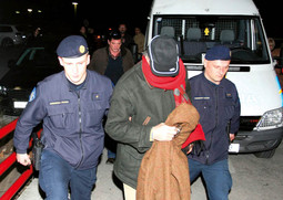 ANTUN KRALJ concealed his face when being taken in to Split police custody
