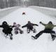 Osječane paralizirao gusti snijeg koji pada već dva dana. Obitelj radi "anđele" u snijegu. Photo: Marko Mrkonjić/PIXSELL